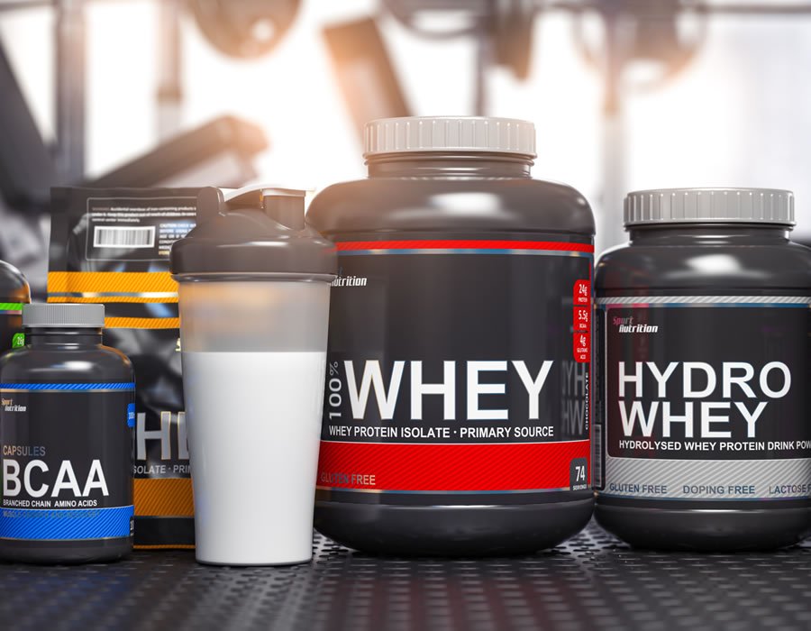 Sports nutrition supplements and chemistry for bodybuilding in gym. Whey protein casein, bcaa, creatine cans